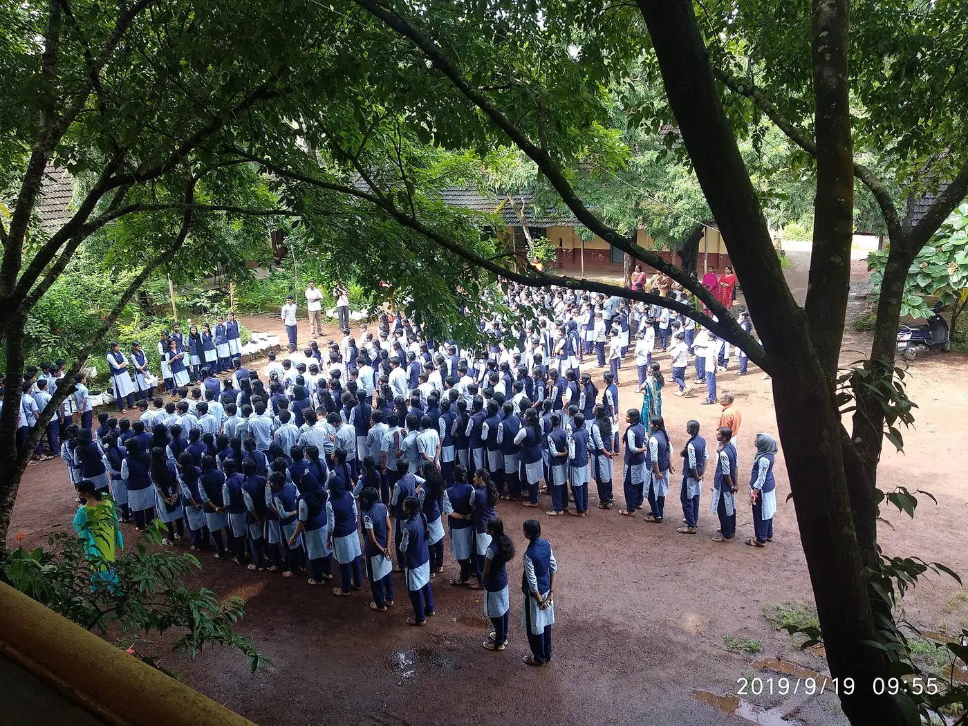 School assembly under the trees in Kerala
