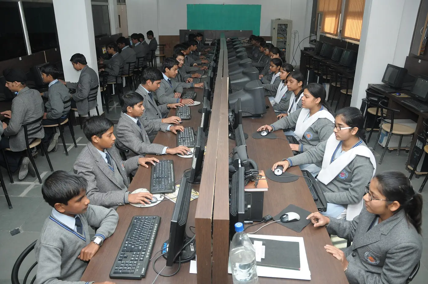 Students working in a modern school computer lab