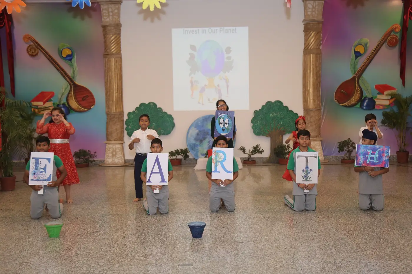 Young students presenting at an Earth Day event