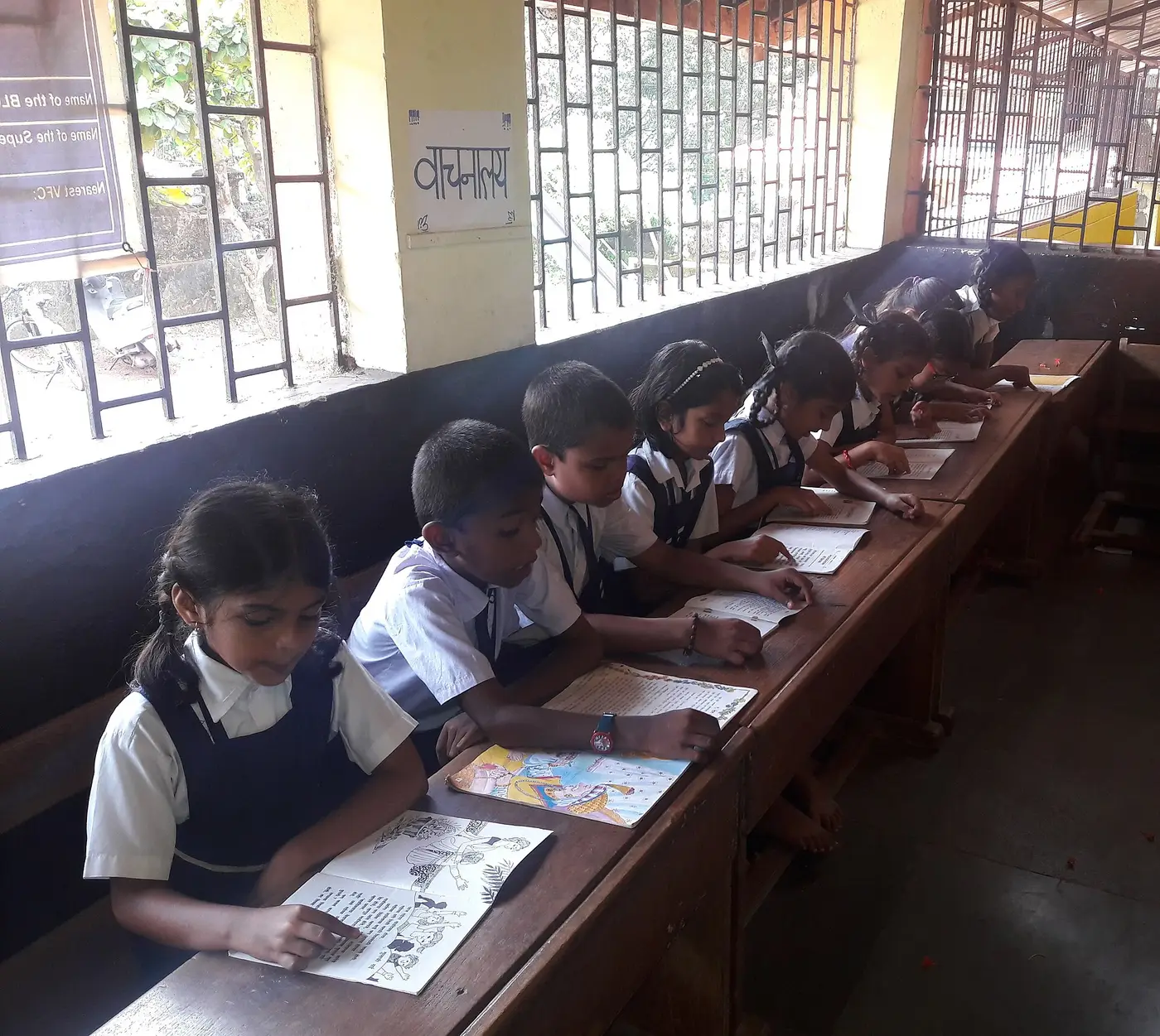 Students reading together in a school library